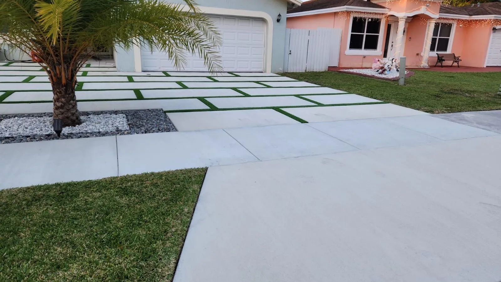 turf installed between concrete pavers to create a unique and modern driveway in Miami, FL