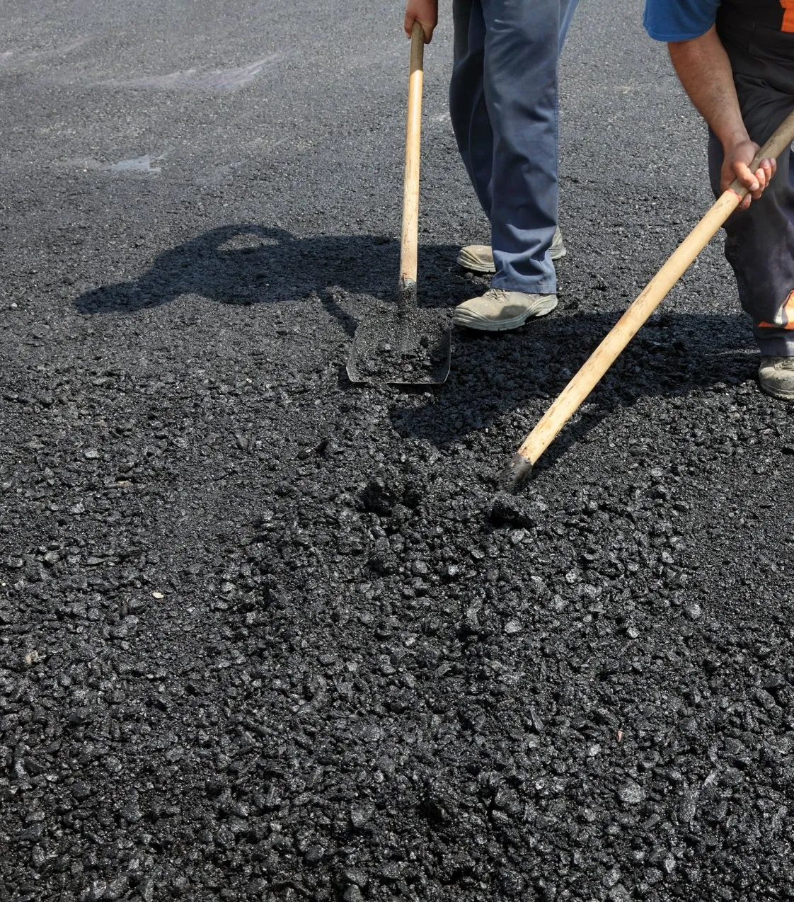 Parking Lot contractors spreading asphalt in Miami